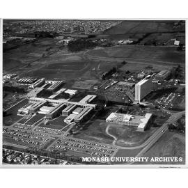 Aerial view of site and buildings, November 1963, from west with car parks in foreground