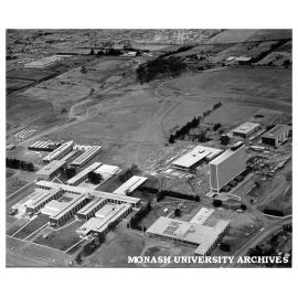 Aerial view of site and buildings, January 1964, from south west with Medicine building in foreground