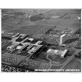 Aerial view of site and buildings, September 1963, from west with car park in foreground