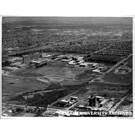 Aerial view of site and buildings, April 1966, from north west corner with halls of residence in foreground