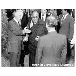 Dalai Lama being welcomed by Deputy Vice-Chancellor Professor Kevin Westfold (left)