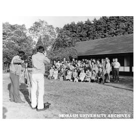 Visitors from Toyama Prefecture in Japan being photographed outside Japanese Studies Centre