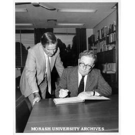 Sir Charles Mackerras signing Visitor's Book with Professor Ray Martin