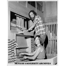 Jurgen and Ruth Ahrend re-assembling organ