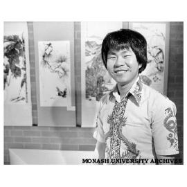 Engineering student Cheah Aik Pin at exhibition of his paintings