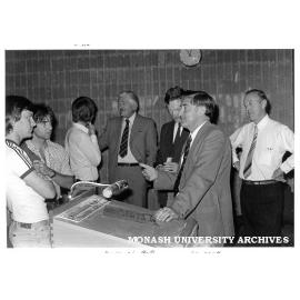 CIT students talking to Mr Tony McDonald (4th left) and Mr Alan Longstaff (2nd right) of Victorian Division of IEA