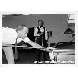 Billiards match between Director Ron Cumming and Eric Hemingway of School of Applied Science