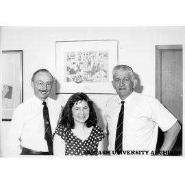Gift to commemorate RMIT centenary. Director of Chisholm Dr Geoff Vaughan (right) with Director of RMIT Dr Brian Smith and Chisholm Fine Art student Michele Kilroy, in front of her gift print