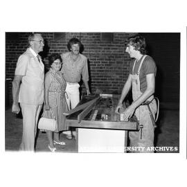 Lisa Brodribb, Ron Cumming and Peter Cutter with building apprentice