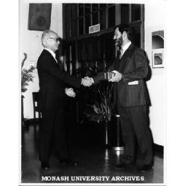 Mr Ted Worsley receiving presentation from Mr Robert Strand