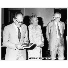 Professor Bob Baxt making presentation to Sir Richard Eggleston with Lady Eggleston (centre)