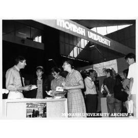 Graduate Careers Show, Exhibition building. Careers and Appointments manager Bryan Barwood, talking to students from Fintona Girls School