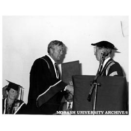 Exchange of Monash-GIAE Affiliation documents, Deputy Chancellor Mr Arnold Hancock (right) and Mr Crofton Hatsell, President of Gippsland Institute Council