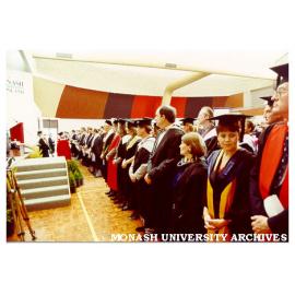 Academic procession leaving dais after first Gippsland graduation ceremony