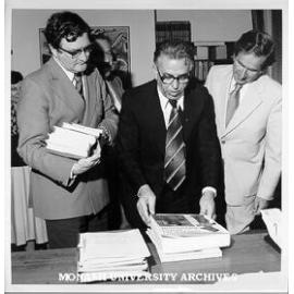 Prime Minister of Macedonia Mr Blagoj Popov with gift of books. Vice-Chancellor Professor Ray Martin (right) and University Librarian Mr Brian Southwell (left)