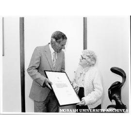 Professor Ray Martin presenting Mrs Vera Moore with Certificate of Appreciation