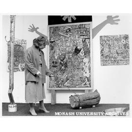 Professor Margaret Plant at Irreverent Sculpture exhibition walking Aleksander Danko's 'Log Dog'