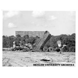 Earthmoving for proposed lake with Humanities building in background