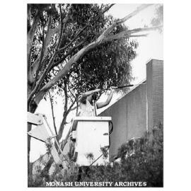 Contractor Philip Waters cleaning south wall of Union building