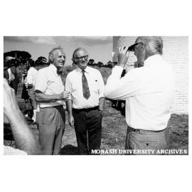 Opening of Monash Observatory at Mt Burnett. Dr Louis Matheson (right) photographing Professors Kevin Westfold (left) and Robert Street