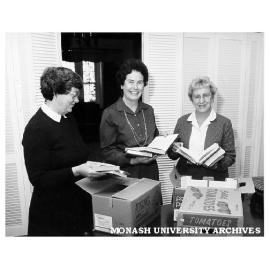 From left, Mrs Alison West, Mrs Rena Martin and Mrs Brenda Holloway, sorting books for the Monash Book Fair