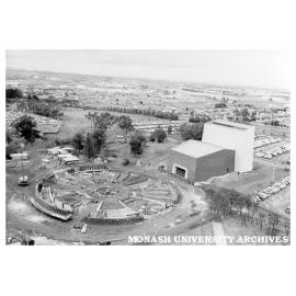 Early construction of rotunda with Alexander Theatre at right