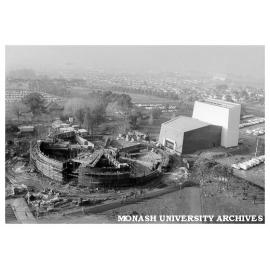 Early construction of rotunda with Alexander Theatre at right