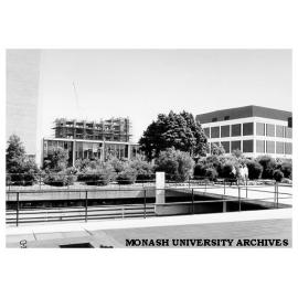 Submerged loading dock, west end of Menzies building with Biology building under construction in background