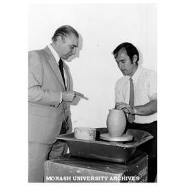 Caulfield Technical College Ceramics student Neil Turney, demonstrating at the Industrial Design Centre, Melbourne, watched by R. A. Rosenfeldt (left), Chairman Industrial Design Commission of Australia