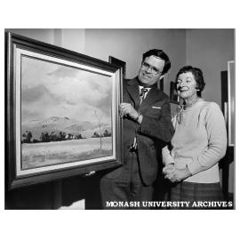 Dr Jack McDonell (left) and Mrs June Fogarty with painting "Summer Gold" by Margaret Cowling