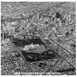 Aerial view of Melbourne CBD from over Fitzroy with Exhibition Building in foreground