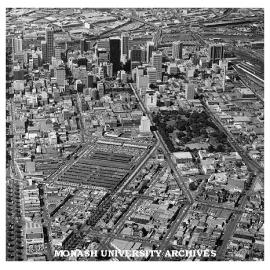 Aerial view of western end of Melbourne CBD with Victoria Market and Flagstaff Gardens in foreground