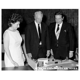 Chancellor Sir Douglas Menzies (centre) presenting model of proposed Krongold Centre to Dinah and Henry Krongold