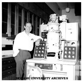 Dr Alex McLaren with 200kv electron microscope