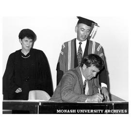 Signing of Monash-GIAE Affiliation agreement, Mr Barry Cunningham MP, Ms Jenny Hill (Secretary to Gippsland Institute Council) and Registrar Mr Tony Pritchard looking on.