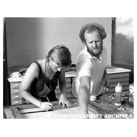 Tutor in printmaking Mr John Neeson at work with printmaking student Georgina Clark