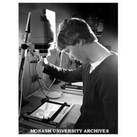 Student Jason Lewis at work in Graphic Design darkroom