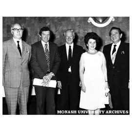 Guests at presentation of model of proposed Krongold Centre to Dinah and Henry Krongold (right)