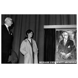 Presentation of portrait by Christine Backhouse (centre) to Vice Chancellor Sir Louis Matheson