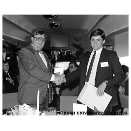 John Taaff (left) presenting the Point of Purchase Media Award to John Dawson