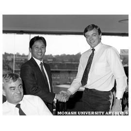 Choon Seane Lee receiving the Frank Small & Assoc. Award in marketing from Kevin Sharp