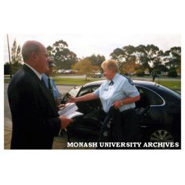 Police Chief Commissioner Ms Christine Nixon arriving at Berwick campus for lecture to public relations students, greeted by Peter Scholem (Public Relations lecturer) and Barry Cavanagh (Security Guard).