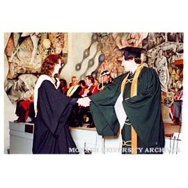 Stephanie Webb receiving Bachelor of Pharmacy from Thomas Lynden-Bell, President, Victorian College of Pharmacy