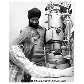 Research Fellow Surindar Singh explains the purpose of an electron microscope to Jackie Holmes at Open Day '79