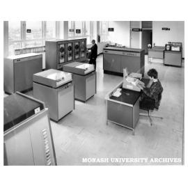 Caulfield Institute of Technology Computer Centre. Console operator Mrs M. Ballantyne and Mr Ray Newland working at the ICL 1903A installation.