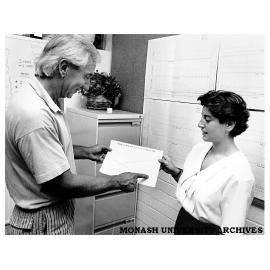 Dr Chris Sharpley (left), Stress Management and Counseling Clinic, speaks speaks to test subject.