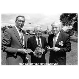 Mr George Bates (left), SEC Chief General Manager, Mr Peter Coats, CFCL Chairman and Pro VIce-Chancellor Professor Tom Kennedy hold ceramic fuel cell components