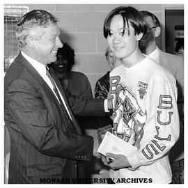Acting Vice-Chancellor Professor Robert Porter presents the Monash Prize to Mr Quynh (Peter) Vien, Year 11 student at Westall Secondary College, South Clayton
