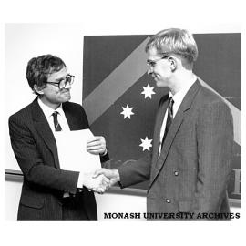 Dean of Engineering Professor Peter Darvall (left) presents the Ian Langlands medal to Mr Lindsay White, top student in the Faculty of Engineering in 1991