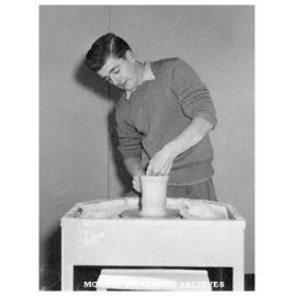 Art student at work in the Myer's window at Commonwealth Technical Training Week exhibition at Chadstone shopping centre.